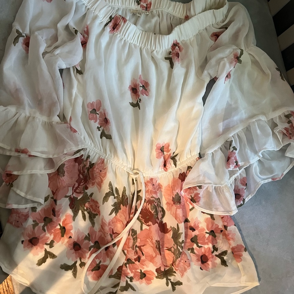 White floral off the shoulders romper. Size M